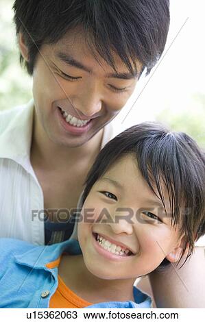 Stock Image - Close up of father and son . Fotosearch