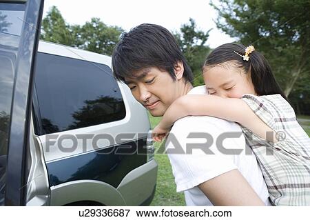 Daughter Sleeping on Father's Back View Large Photo Image Stock Photo - Daughter Sleeping on Father's Back. Fotosearch