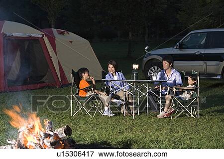 Stock Photo - Families at Table. Fotosearch