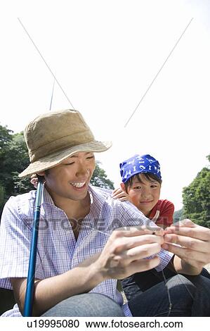Father and Son Baiting Fishing Hook View Large Photo Image Stock Image - Father and Son Baiting Fishing Hook. Fotosearch