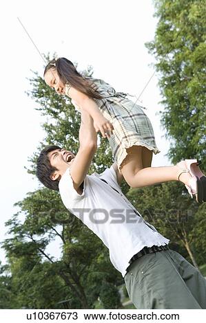 Father Holding Daughter in the Air View Large Photo Image Stock Image - Father Holding Daughter in the Air. Fotosearch