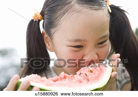 Stock Photograph - Girl Eating Watermelon. Fotosearch