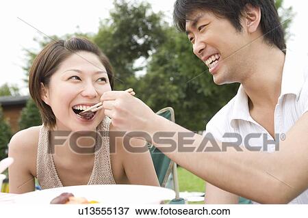 Man Feeding to Woman View Large Photo Image Stock Photo - Man Feeding to Woman. Fotosearch