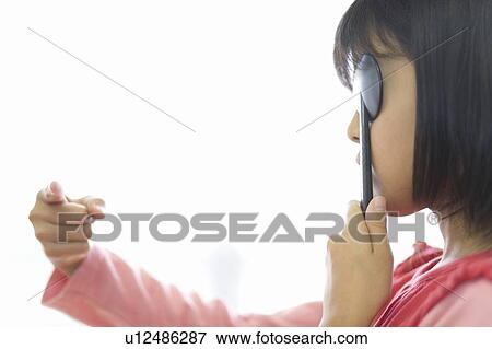 Stock Photo - A Japanese Girl Taking Eyesight Test. Fotosearch