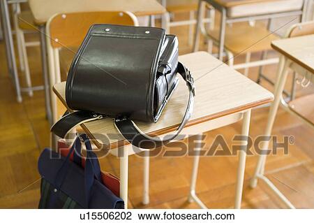 Stock Image - A School Bag On The Desk. Fotosearch