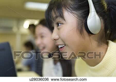 Stock Photograph - Elementary Students Learning Computer Skills. Fotosearch