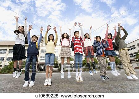 Japanese Students In a Line Jumping At Schoolyard View Large Photo Image Stock Photo - Japanese Students In a Line Jumping At Schoolyard. Fotosearch