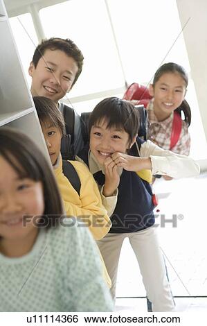 Japanese Students Peeping At A Girl Stock Photograph U Fotosearch