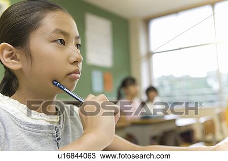 Stock Image - Japanese Students Studying In The Classroom. Fotosearch