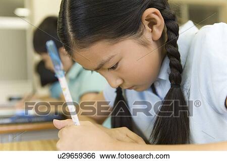 Stock Photograph - Japanese Students Studying In The Classroom. Fotosearch