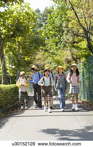 Stock Photo - Japanese Students Walking On The Street. Fotosearch