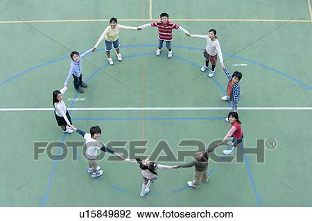 Stock Image - Students Making A Circle At Schoolyard. Fotosearch