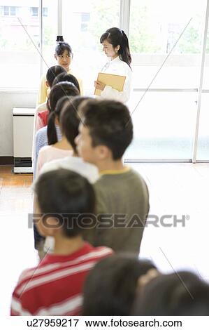 Students Waiting in a line for Height Measuring View Large Photo Image Stock Photo - Students Waiting in a line for Height Measuring. Fotosearch