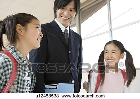 Teacher And Student at The School View Large Photo Image Stock Photo - Teacher And Student at The School. Fotosearch