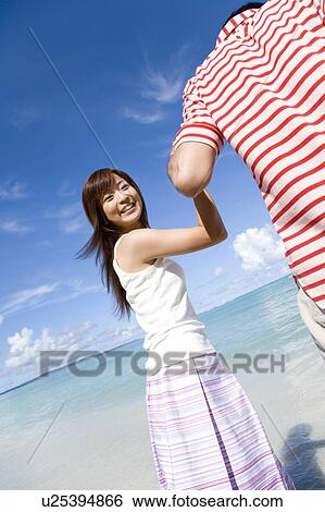 Young couple on beach, portrait for woman, smiling, Saipan, USA View Large Photo Image Stock Photograph - Young couple on beach, portrait for woman, smiling, Saipan, USA . Fotosearch
