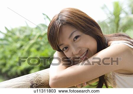 Young woman by the balcony, Siapan View Large Photo Image Stock Image - Young woman by the balcony, Siapan. Fotosearch