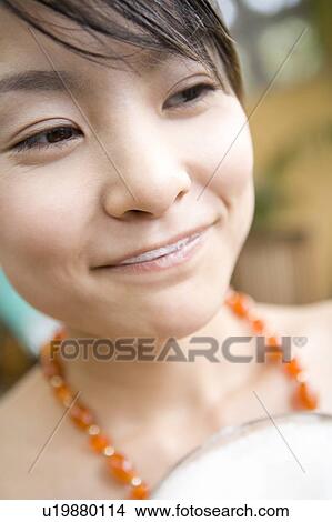Picture - Young woman drinking beer, Saipan. Fotosearch