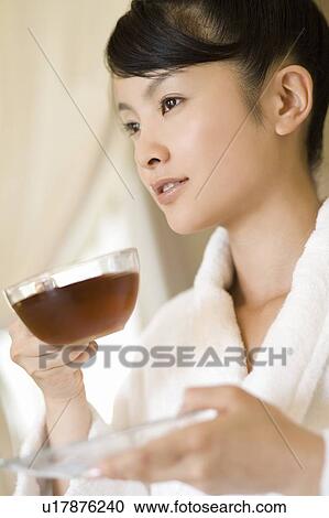 Young woman drinking tea, Saipan View Large Photo Image Stock Image - Young woman drinking tea, Saipan. Fotosearch