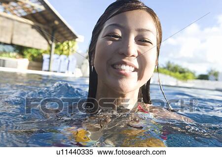 Young woman in a swimming pool, Saipan View Large Photo Image Stock Photography - Young woman in a swimming pool, Saipan . Fotosearch