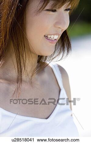 Young woman on beach, smiling, Saipan, USA View Large Photo Image Stock Image - Young woman on beach, smiling, Saipan, USA . Fotosearch