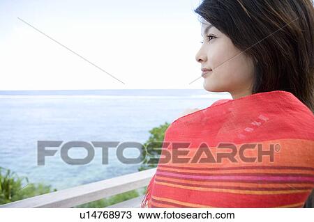 Young woman wrapped around in a scarf, Saipan View Large Photo Image Stock Image - Young woman wrapped around in a scarf, Saipan. Fotosearch
