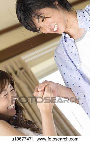 Young couple holding hands, Saipan View Large Photo Image Stock Image - Young couple holding hands, Saipan. Fotosearch