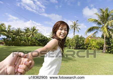 Young woman pulling hands, Saipan View Large Photo Image Stock Photography - Young woman pulling hands, Saipan. Fotosearch