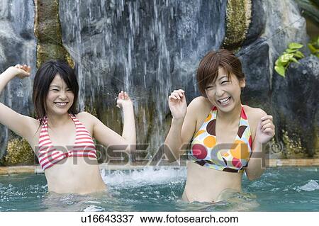 Two women in bikini in swimming Pool, Saipan View Large Photo Image Stock Photo - Two women in bikini in swimming Pool, Saipan. Fotosearch