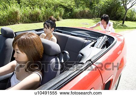 Young man pushing the car, women sitting in the car, Saipan, USA View Large Photo Image Stock Photography - Young man pushing the car, women sitting in the car, Saipan, USA . Fotosearch