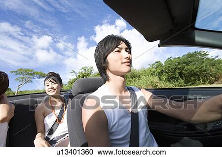 Young people smiling in the car, man driving, Saipan, USA View Large Photo Image Stock Image - Young people smiling in the car, man driving, Saipan, USA . Fotosearch