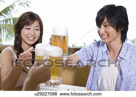 Young people toasting with beer, Saipan View Large Photo Image Stock Photo - Young people toasting with beer, Saipan. Fotosearch
