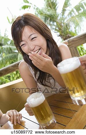Stock Image - Young woman laughing, Saipan. Fotosearch