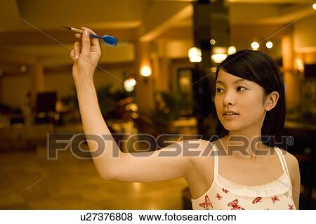 Young woman playing darts, Saipan View Large Photo Image Stock Photo - Young woman playing darts, Saipan. Fotosearch