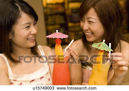 Young women drinking a cocktail, Saipan View Large Photo Image Stock Image - Young women drinking a cocktail, Saipan. Fotosearch