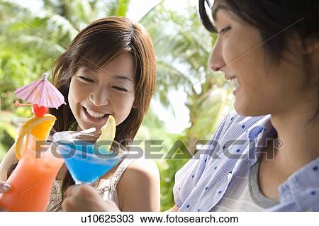 Young Couple toasting with cocktail, Saipan View Large Photo Image Stock Image - Young Couple toasting with cocktail, Saipan. Fotosearch