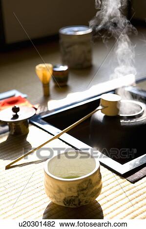 Stock Image - Japanese tea set on Tatami mats, high angle view, differential focus, Japan. Fotosearch