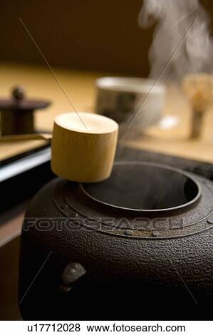 Stock Photo - Steam coming out of a tea kettle, close up, differential focus, Japan. Fotosearch
