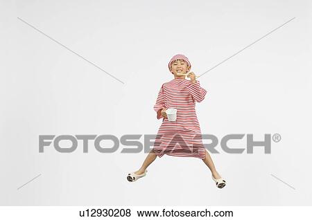 Stock Photo - Boy brushing teeth. Fotosearch
