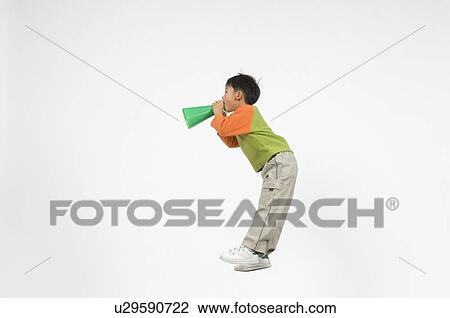 Stock Image - Boy cheering with megaphone. Fotosearch