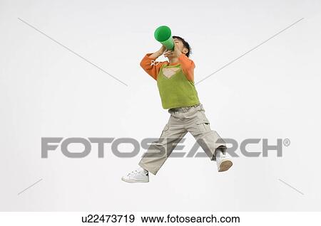 Boy cheering with megaphone View Large Photo Image Stock Photo - Boy cheering with megaphone. Fotosearch
