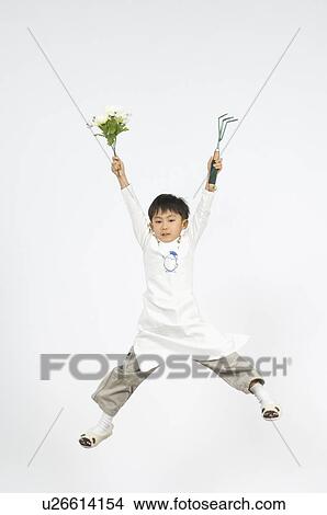 Picture - Boy holding flower. Fotosearch