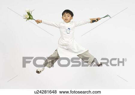 Stock Photo - Boy holding flower. Fotosearch