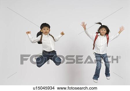 Elementary students jumping View Large Photo Image Picture - Elementary students jumping. Fotosearch
