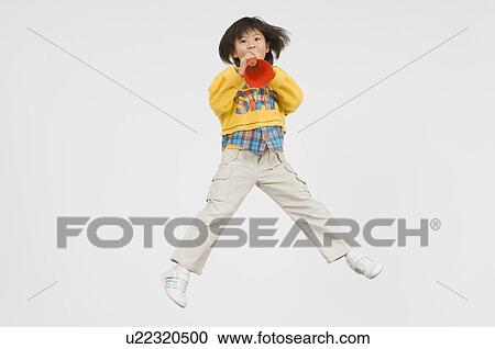 Girl cheering with megaphone View Large Photo Image Stock Image - Girl cheering with megaphone. Fotosearch