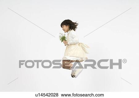 Girl holding flower View Large Photo Image Stock Photo - Girl holding flower. Fotosearch