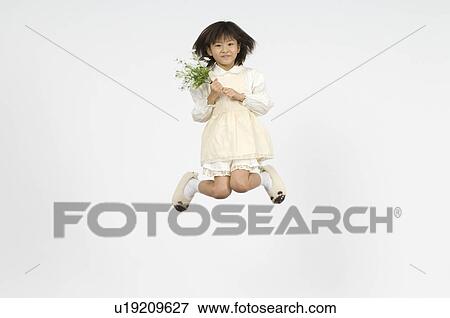 Stock Photo - Girl holding flower. Fotosearch