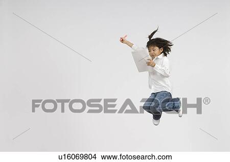 Picture - Girl holding notebook and pen. Fotosearch