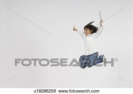 Girl holding notebook and pen View Large Photo Image Stock Photo - Girl holding notebook and pen. Fotosearch