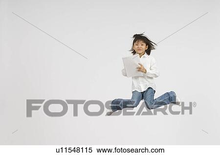 Stock Photography - Girl holding notebook. Fotosearch