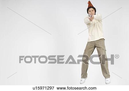 Stock Photo - Man holding firecracker. Fotosearch